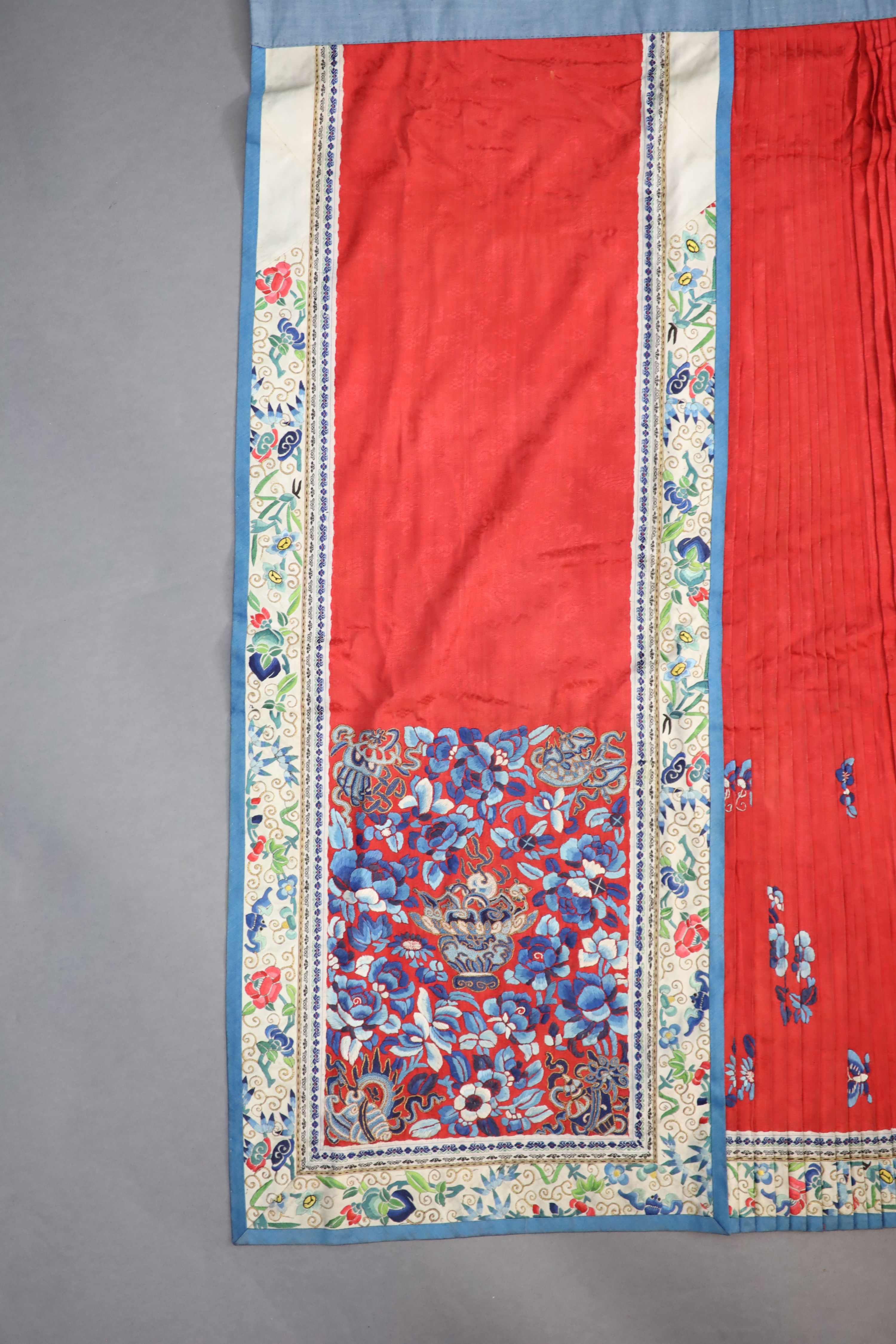 A 19th century Chinese red ground silk skirt